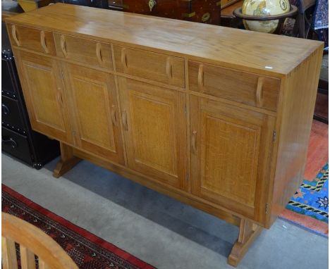 A good quality bespoke golden oak sideboard with four drawers over four panelled cupboard doors, 157 cm wide x 100 cm high x 