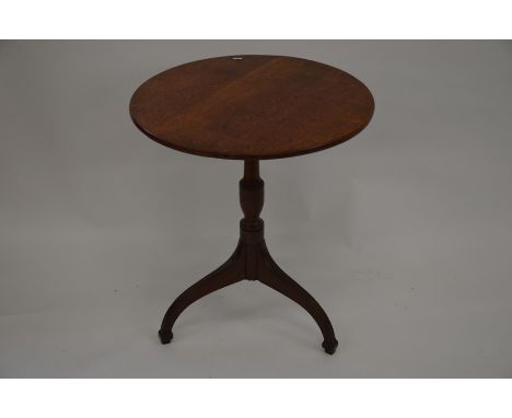 A small round mahogany tilt-top table on shaped tripod base, 60 cm diam, 68 cm high