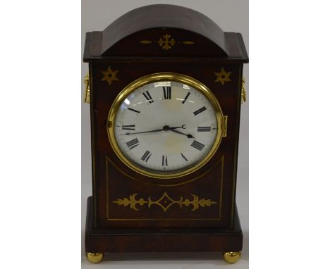 A mahogany cased and brass inlaid thirty hour mantle clock on bun feet with domed top and ring carry handles, white enamel di