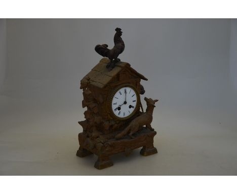 A 19th century French spelter-cased mantle clock, modelled with a fox chasing chickens, with Japy Freres twin-train drum move