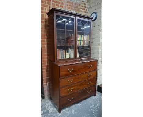 A mahogany secretaire library bookcase, 19th century, the Arabic arched glazed cabinet doors over a fitted secretaire drawer 