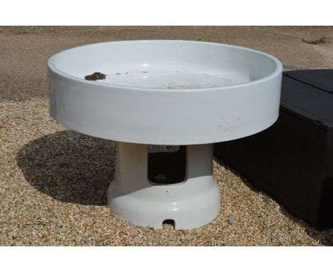 A large glazed porcelain sink on a conforming central pedestal base 120 cm diameter x 81 cm high