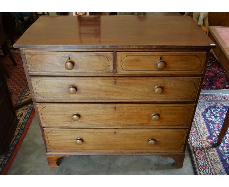 A 19th century mahogany chest of two short over three long drawers with turned handles, raised on shaped bracket feet, 83cm h