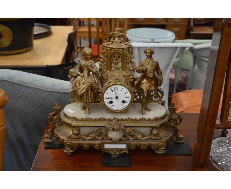 A 19th century French gilt metal and onyx figural twin train mantle clock