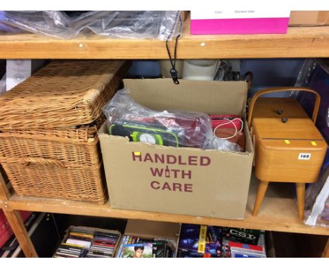 A shelf of assorted to include a sewing box