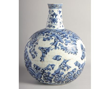 A VERY LARGE CHINESE BLUE AND WHITE PORCELAIN MOON FLASK VASE, decorated with a central dragon against stylised waves, 43cm h