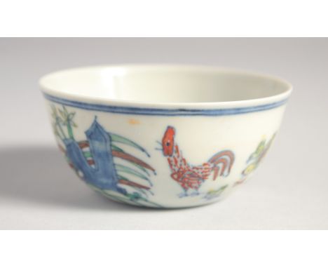 A CHINESE DOUCAI PORCELAIN CUP, painted with chickens, 8cm diameter.