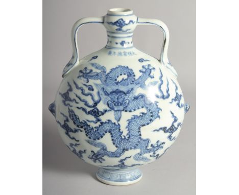 A CHINESE BLUE AND WHITE PORCELAIN TWIN HANDLED MOON FLASK painted with central dragon surrounded by stylised clouds. 28cm hi