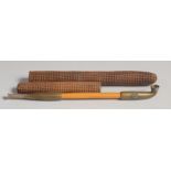 A JAPANESE TOBACCO PIPE, with metal mounts, together with a woven case, pipe 19.5cm long.