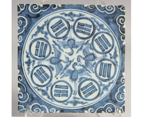 A CHINESE BLUE AND WHITE GLAZED TEMPLE TILE. 19.5cm square