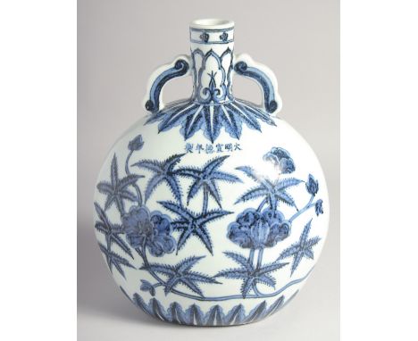 A CHINESE BLUE AND WHITE PORCELAIN TWIN HANDLE MOON FLASK, decorated with flora and bearing a six-character mark, 27.5cm high