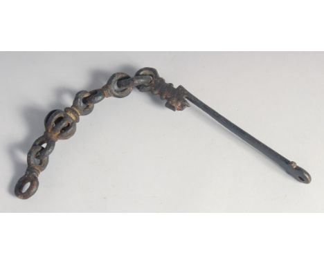 AN ISLAMIC IRON DOOR KNOCKER.
