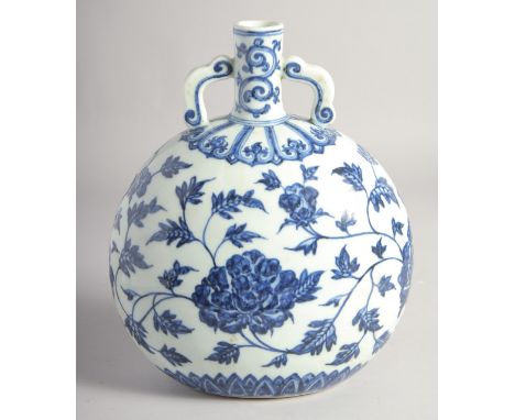 A CHINESE BLUE AND WHITE PORCELAIN TWIN HANDLE MOON FLASK, painted with large flower heads and vine,  25cm high.