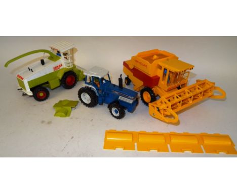 Britains Powerfarm unboxed 9321 Ford TW35 Powered Tractor, 9322 New Holland motorised Combine Harvester and  9323 Claas motor