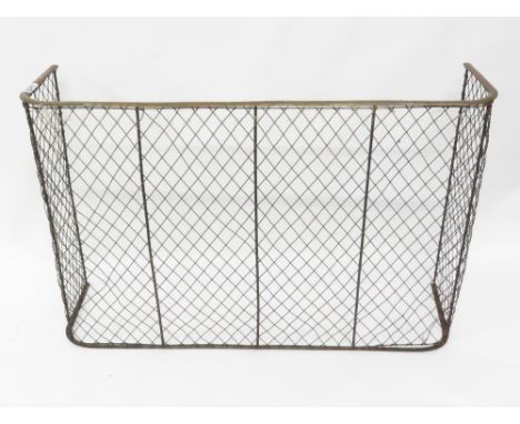 A 19th Century fireguard, with a wirework front and side, and a brass rail, 69cm high, 104cm long, 30cm deep