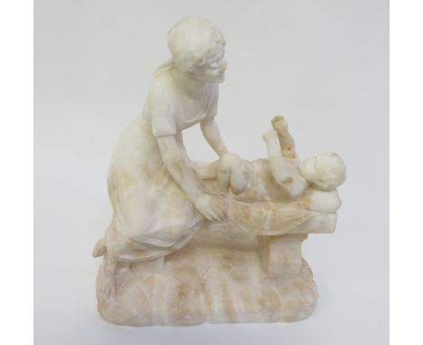 A Fiaschi (19th-20th Century Italian) carved alabaster group of a lady with her baby on a bench, signed, 45cm high