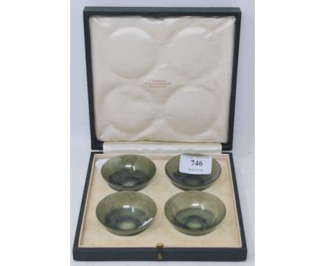 A set of four green jade bowls, 6 cm diameter, in an H Simmons, 60 &amp; 61 Burlington Arcade Piccadilly W1 box Condition rep