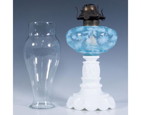White milk glass pressed column and base, adorned with a beautiful Fenton pale blue daisy and fern glass front. Includes a cl