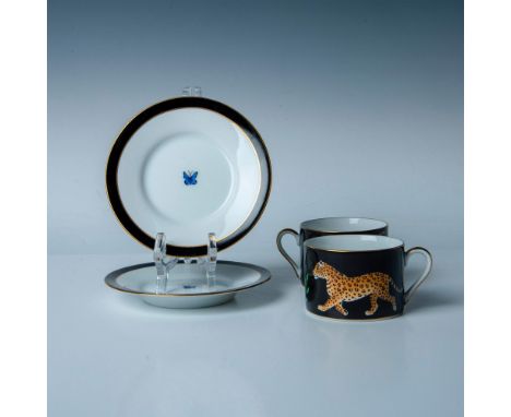 A stunning set of two teacups and saucers, featuring striking black and white designs with jaguars elegantly painted on the t