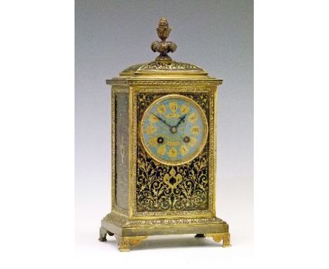 19th Century brass and black enamel cased mantel clock, the top having a foliate finial, blue enamel dial with Roman numerals