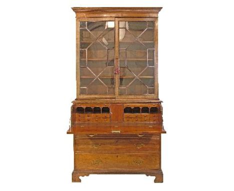 George III mahogany two section secretaire bookcase, the upper section fitted four shelves enclosed by a pair of astragal gla