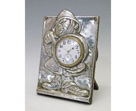 Edward VII silver and oak easel clock having humorous embossed decoration depicting a policeman, makers M. & C. Lister Ltd, B