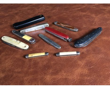 An intriguing collection of 10 vintage pocket knives, each with its own unique character, size, and purpose. This assortment 