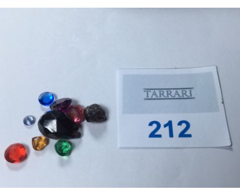 A diverse collection of loose gemstones totaling 12.55 carats, tested on a Presidium Duo Tester. This lot includes garnet, ru