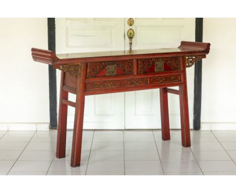 A CHINESE RED LACQUER CONSOLE TABLE
With two drawers and carved gilt archaic scroll decoration
94 high x 38 deep x 160cm wide
