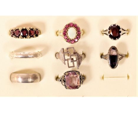 A silver gilt garnet five stone ring, a silver gilt opal ring and 6 silver rings 