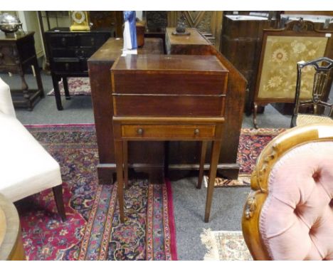 An early 19th century crossbanded mahogany fold out travelling or campaign desk, with gilt brass handles, enclosed slope and 