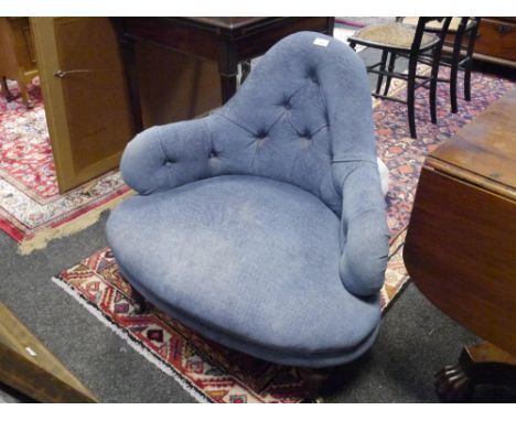 A mid-Victorian button back corner chair, raised on fluted tapering walnut legs. 