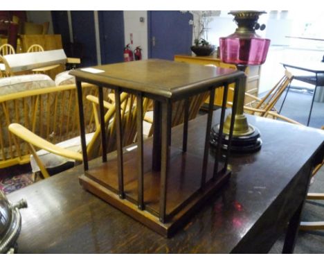 An Edwardian mahogany desk top revolving bookcase. 30cm by 28cm square