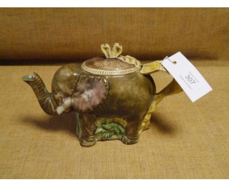 A 19th century majolica teapot, possibly Foresters, modelled with trunk spout and ribbon handle. Length across handle 24cm