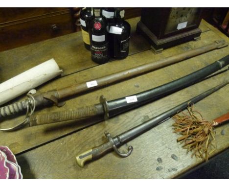 A Japanese katana, probably World War II period, with leather-wrapped sharkskin grip, plain metal tsuba and 69cm steel blade 