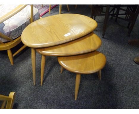 A set of three Ercol light elm "Pebble" nesting tables. 