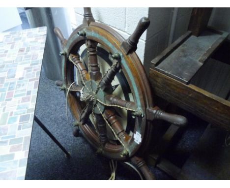 A brass mounted oak ship's wheel, Mactaggart Scott, Edinburgh, later converted to a ceiling light fixture. Diameter 92cm