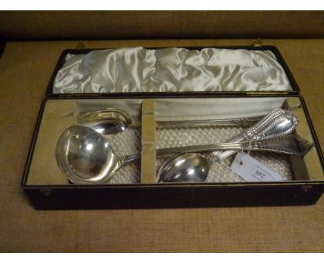 An Edwardian cased silver soup ladle and basting spoon, Walker & Hall, Sheffield 1901, Antique Grecian pattern, together with