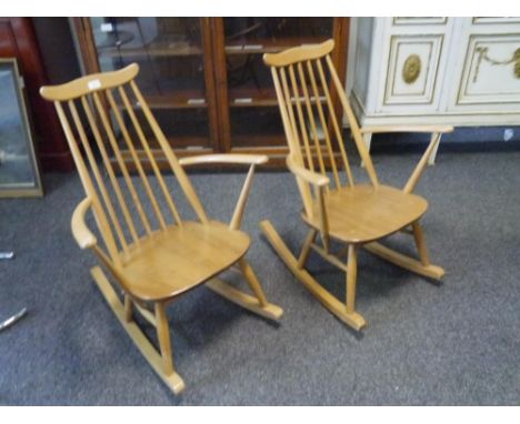 An pair of Ercol light elm rocking chairs