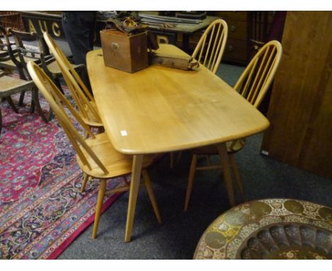 An Ercol light elm dining table and four chairs, the table with rounded corners and raised on square section splayed legs, th