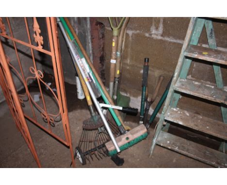A quantity of long handled gardening tools etc.