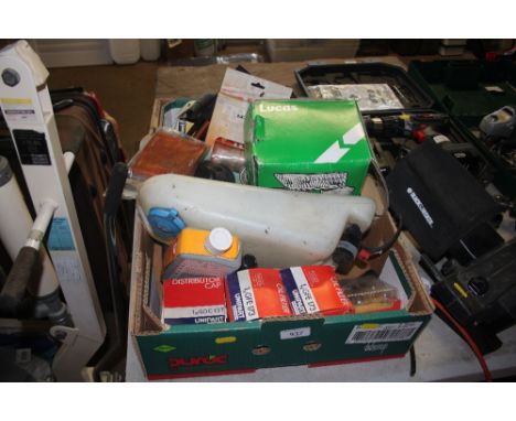 A box of various car parts; together with a 7" Lucas spot lamp