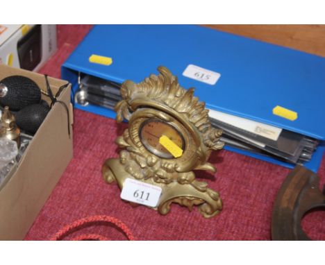 A brass cased mantel clock 