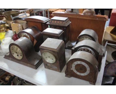 A quantity of mantel clocks and clock cases for restoration
