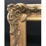20th Century English School. A Gilt Composition Frame with Swept and Pierced Centres and Corners,