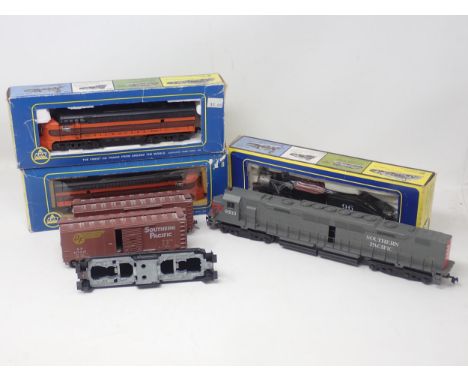 A boxed AHM HO scale 0-4-0 Shifter, an FM Locomotive and Dummy Unit, an unboxed Southern Pacific diesel Locomotive, a diesel 