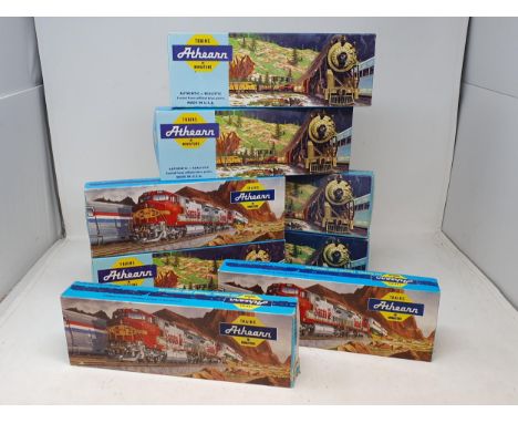 Nine boxed Ahearn HO scale American Locomotives and three boxed Wagons 