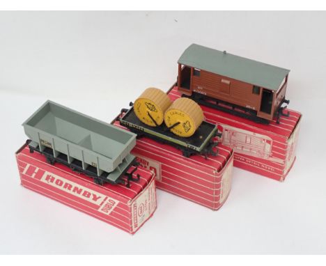 Three Hornby Dublo Wagons including 4644 Hopper Wagon, 4646 Low-sided Wagons with aluminium cable drums and rare 4310 MR Good