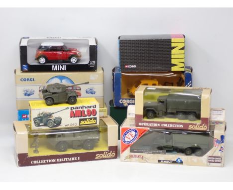 A boxed Solido Panhard AML90, a Solido M34 Army Wagon, a Solido No.6027 VAB 4x4, a Solido limited edition GMC 6x6 Army Truck,