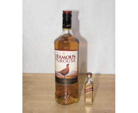A litre bottle of Famous Grouse single malt Scotch whisky and a miniature Johnny Walker whisky